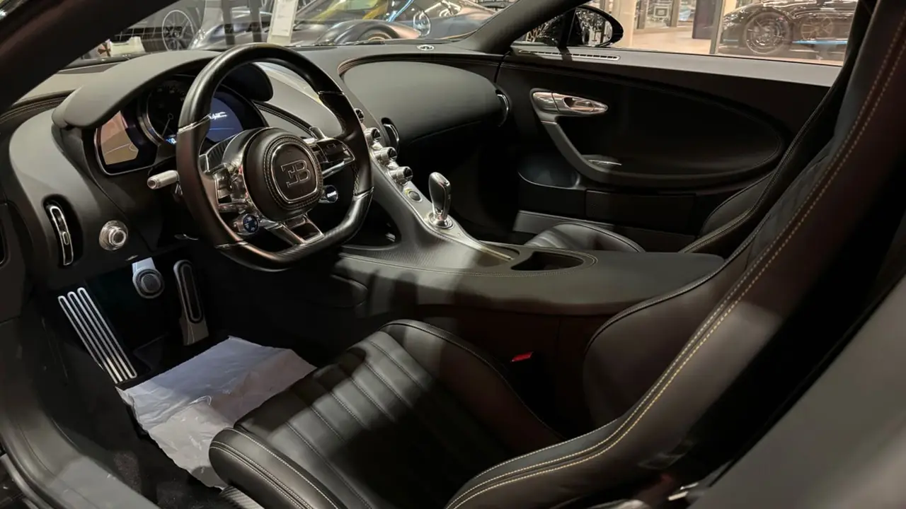 Bugatti Chiron 110 Ani 2019, interior — Cannes Luxury Car Rental, Cannes. Bugatti Chiron 110 Ani in Cannes Hiring a Bugatti Chiron 110 Ani in Cannes provides an…